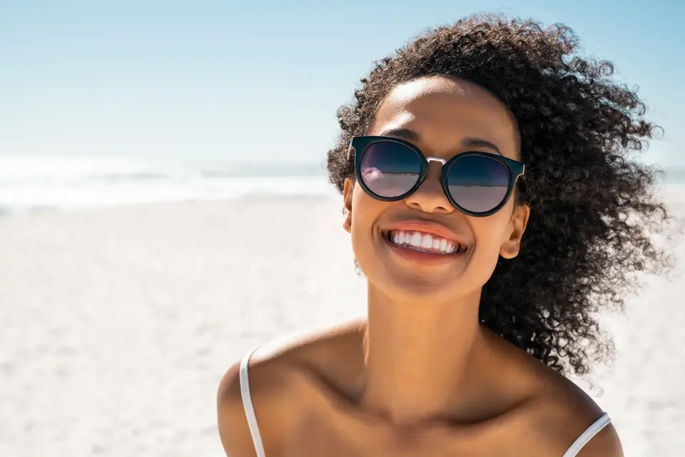 Woman smiling at the beach